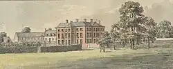 buildings standing in a park with trees