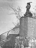 The statue next to the city walls in the 1970s.