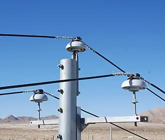 Power lines supported by ceramic pin-type insulators in California, USA