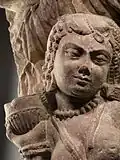 Yakshi with onlookers (detail), dated 20 BCE.