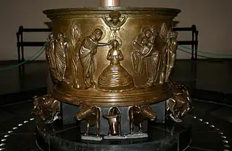 Baptismal font at St Bartholomew's Church, Liège sculpted by Renier de Huy in Liège, Belgium