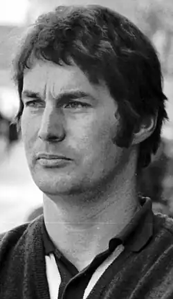 A black and white photograph of Robin Herd looking at the right of the camera