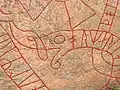 Serpent head with nose flap and start of text
