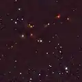 Wide view around SR 12 with VISTA, showing many young stars in the Ophiuchus dark clouds. SR 12 is the blue star at the center and SR 12c is the faint blue "star" below SR 12.