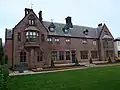Saint Joseph's Home, Woolton Road, Childwall, Garden front showing 1866 alterations by Augustus by Edward Welby Pugin (1845–47 & 1866; Grade II*)