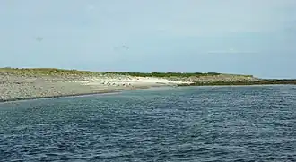A sandy bay at the south-east corner of Holm of Scockness