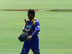 A man wearing blue Sri Lankan jersey