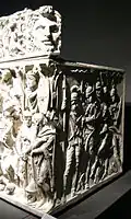 Two barbarians prostrate themselves before the Roman commander, probably the deceased[69][71]