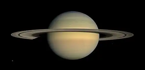 Image 17 Cassini–Huygens Photograph credit: NASA / JPL / Space Science Institute The Cassini–Huygens space-research project involved a collaboration between NASA, the European Space Agency, and the Italian Space Agency to send a probe to study the planet Saturn and its system, including its rings and its natural satellites. This natural-color mosaic image, combining thirty photographs, was taken by the Cassini orbiter over the course of approximately two hours on 23 July 2008 as it panned its wide-angle camera across Saturn and its ring system as the planet approached equinox. Six moons are pictured in the panorama, with the largest, Titan, visible at the bottom left. More selected pictures