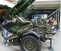 Same gun, with a man nearby for a reference of scale. Markings "Fuerza Aérea Argentina" (English: Argentine Air Force) on the side.