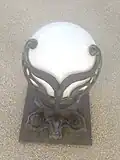 A sconce on the outside of the house.