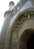 A view of an iwan and minaret
