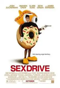 A young man in a donut costume holding a revolver