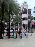 The eastern side of the dargah's primary mosque with its modern veranda. On the right are the steps leading to the Bara Gumbad
