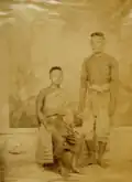 A Siamese couple dressed in traditional attire, 1852