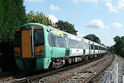 Train 377 122 leaving the station for Horsham.