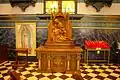 Wooden carving of the Pietà and image of Our Lady of Guadalupe