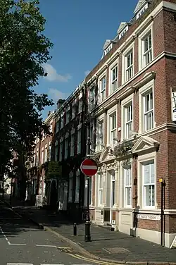 Nos 11-14 (right to left): Grade II listed