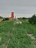 Both of Stoughton's grain elevators alongside the railway