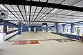 Transfer passageway between Southbound East Rail line Platform 2 (left) and Kai Tak bound Tuen Ma line Platform 3 (right)