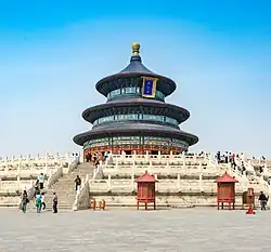 A circular three-storied temple on a stone platform