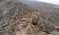 Top of the mountain showing half side of the fortification (Arabic: حِصْن ٱلْغُرَاب, romanized: Hiṣn Al-Ghurāb)