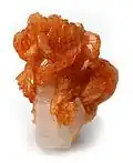 Tinzenite on calcite, 4.5 × 3.5 × 3 cm. Wessels Mine, Kalahari manganese fields, Northern Cape Province, South Africa