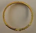 Achaemenid torc from Persia, c. 350 BC, Susa, with ribbed hoop, animal head terminals, and stone inlays, from the Acropole Tomb