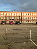 A metal bar and a metal fence constituting obstacles
