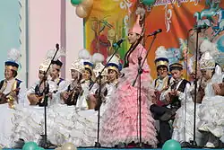 Kazakhs in traditional outfits during a Nowruz musical performance