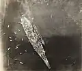 Photo taken from an airplane flying over USS Missouri. USS Buchanan is alongside.