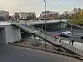 The stairscases connecting Crossroads Square with the bus stops at People's Army Avenue