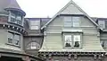 Note the concentric arcs of the gable's shingles