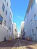 Alleyway behind building looking south