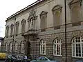 The side of the gallery showing the old entrance and statue of Queen Victoria