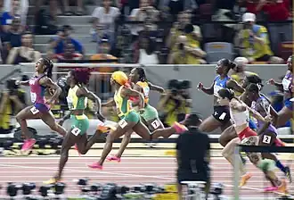 Nine runners finish a 100 m race