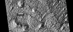 Many layers are visible in this HiRISE image. Dark dust serves to highlight some of the layers.