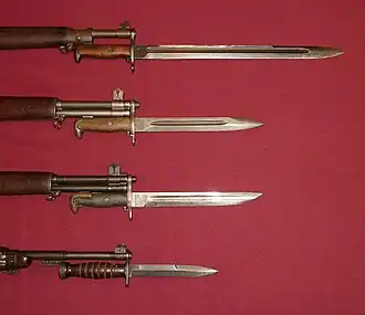 US military bayonets; from the top down, they are the M1905, the M1, M1905E1 Bowie point bayonet (a cut down version of the M1905), and the M4 Bayonet for the M1 carbine. The top 3 blades each have fullers.