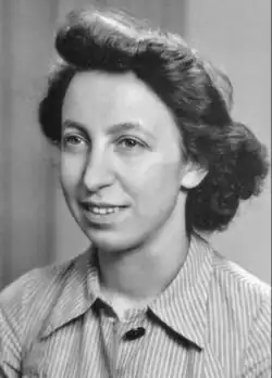 A portrait photograph of Meisel, showing a three quarter view of her